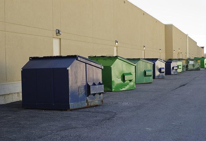 large construction waste containers in a row at a job site in Bridgeport